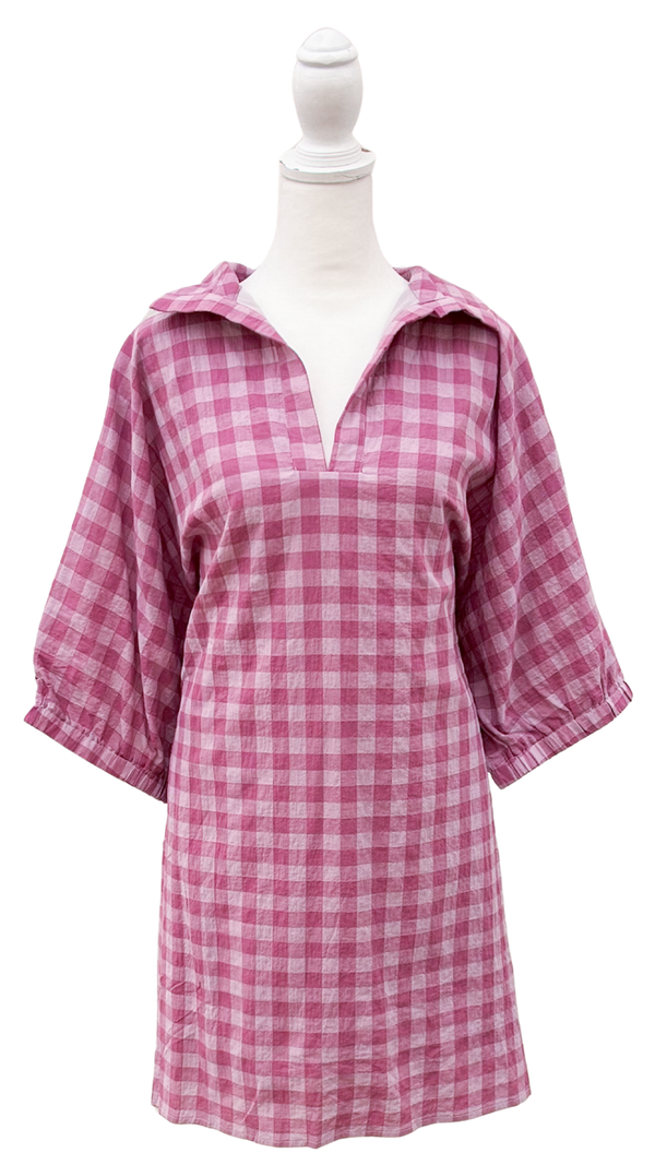 Pink gingham dress on a mannequin against a white background