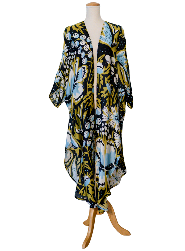 Floral patterned dress on a mannequin against a white background