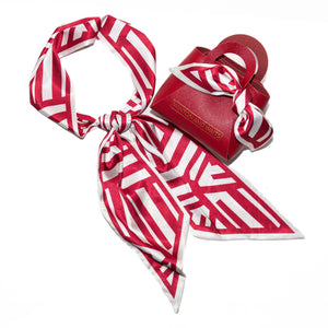 Red and white striped scarf with a matching pouch on a white background