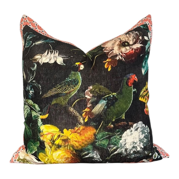 Decorative pillow with bird and floral pattern on a black background