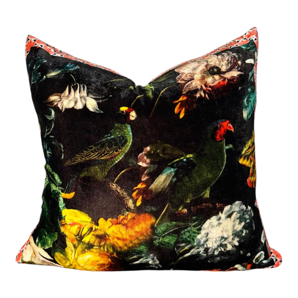 Decorative pillow with bird and floral pattern on a black background
