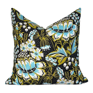 Floral and butterfly patterned pillow on a white background
