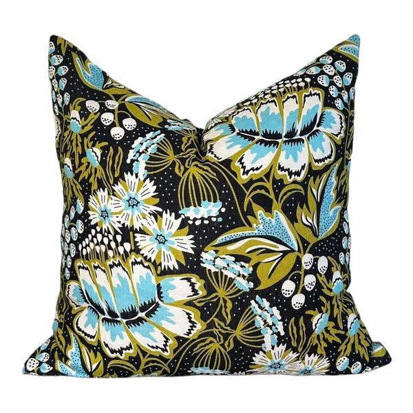 Floral and butterfly patterned pillow on a white background