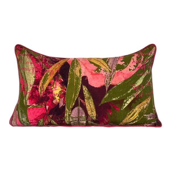 Decorative pillow with a colorful leaf pattern on a white background