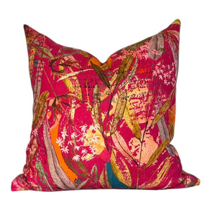 Decorative pillow with a colorful floral pattern on a white background
