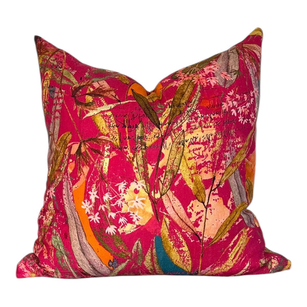 Decorative pillow with a colorful floral pattern on a white background
