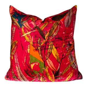 Colorful abstract-patterned pillow on a white background