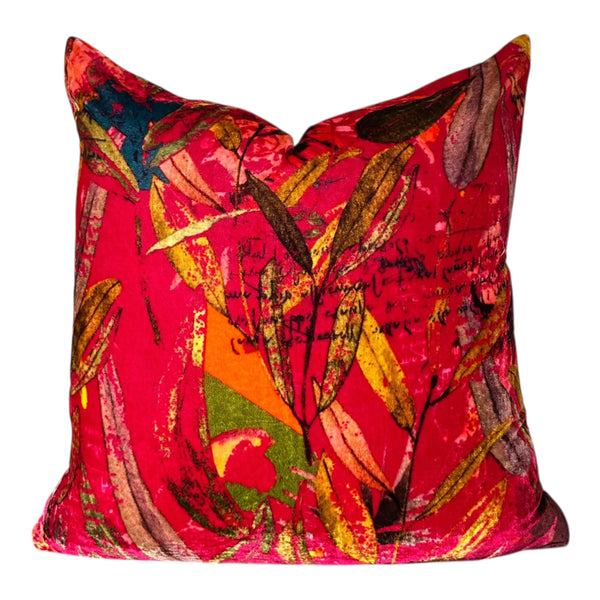 Colorful abstract-patterned pillow on a white background