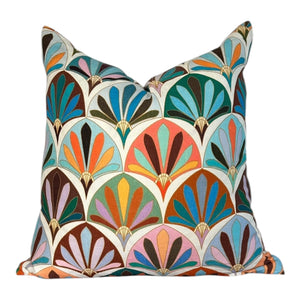 Decorative pillow with a colorful geometric pattern on a white background