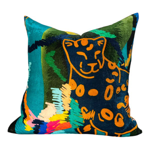 Colorful pillow with a stylized panther design on a white background