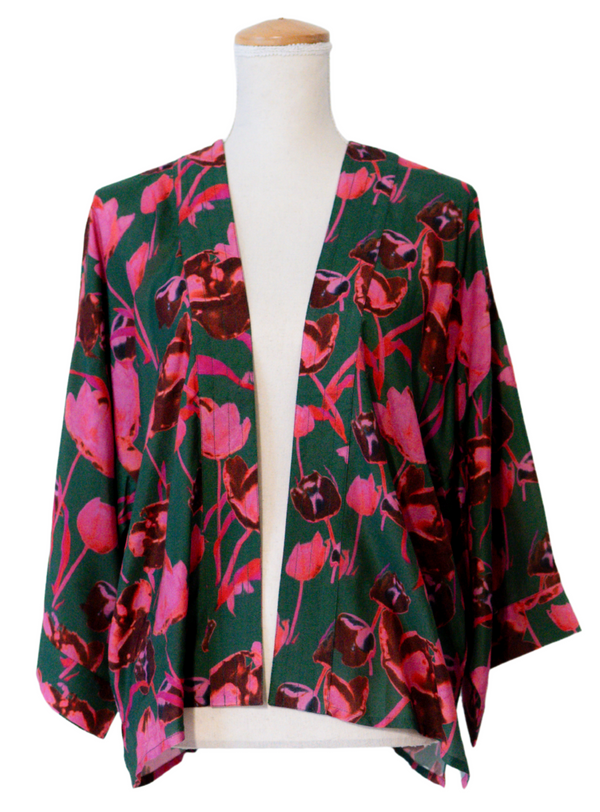 Floral patterned kimono on a mannequin against a white background