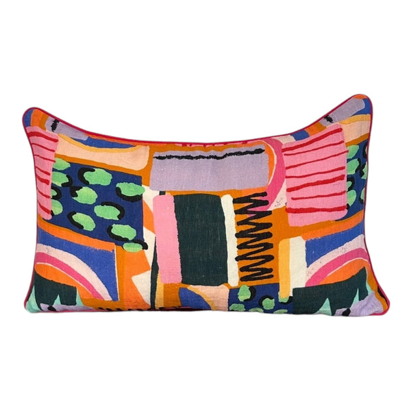 Colorful abstract patterned pillow on a white background