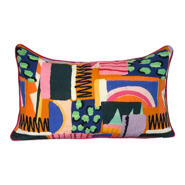 Colorful abstract-patterned pillow on a white background