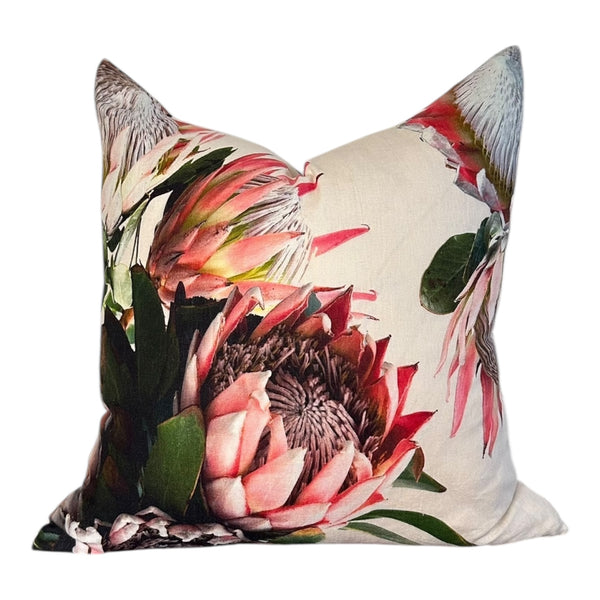 Decorative pillow with floral design on a white background
